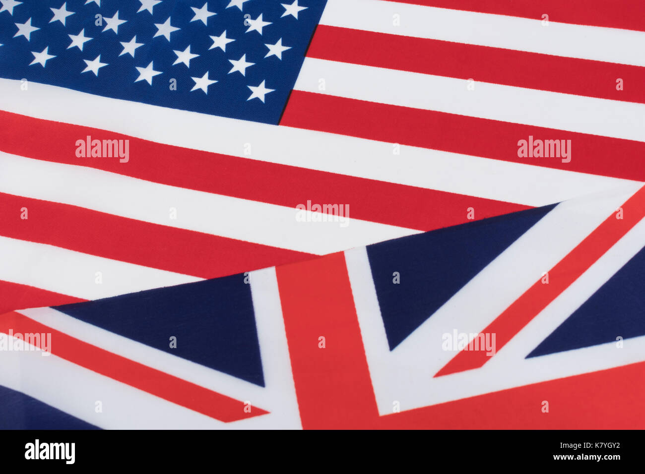 US and UK Union Jack / US UK flags - as metaphor for US-British trade and currency exchange rate. Also US-UK special relationship, UK USA flags. Stock Photo