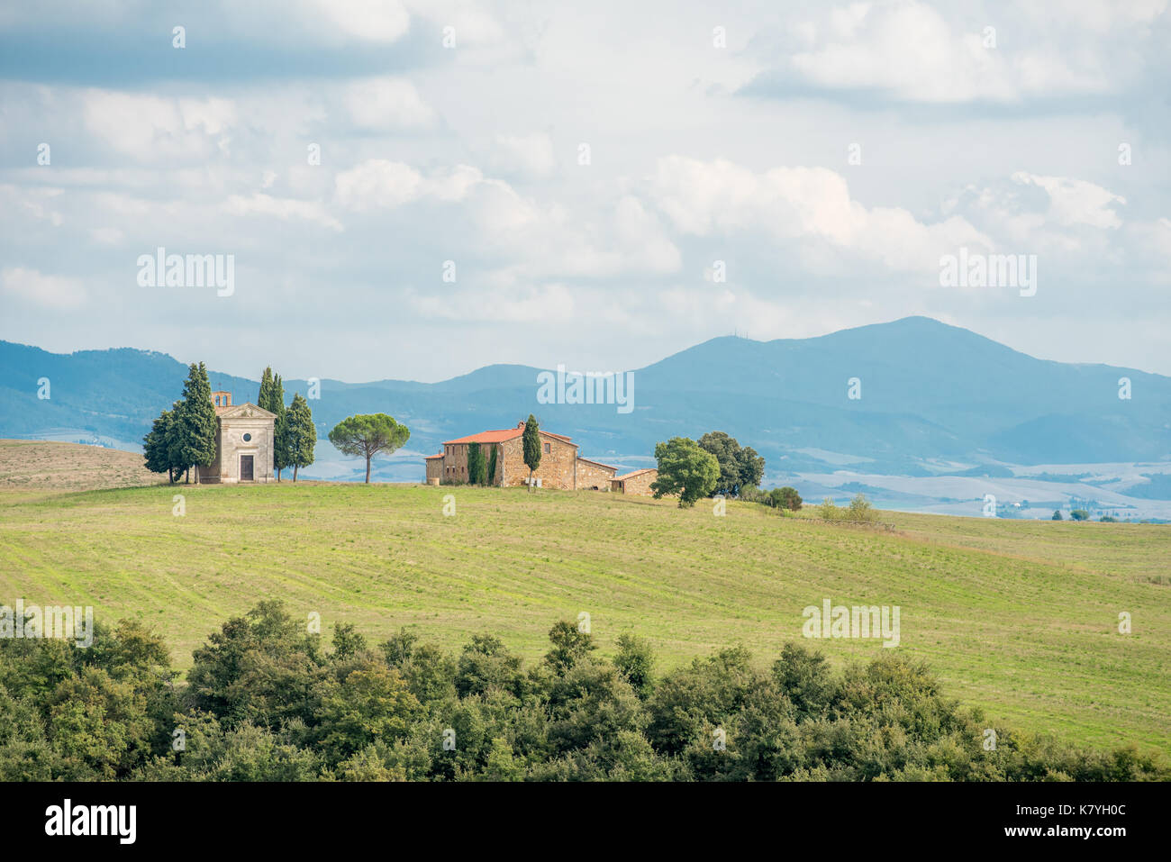 Chapel of the Madonna di Vitaleta in Val d'Orcia, Tuscany, Italy. Monte Amiata visible in the background. Stock Photo
