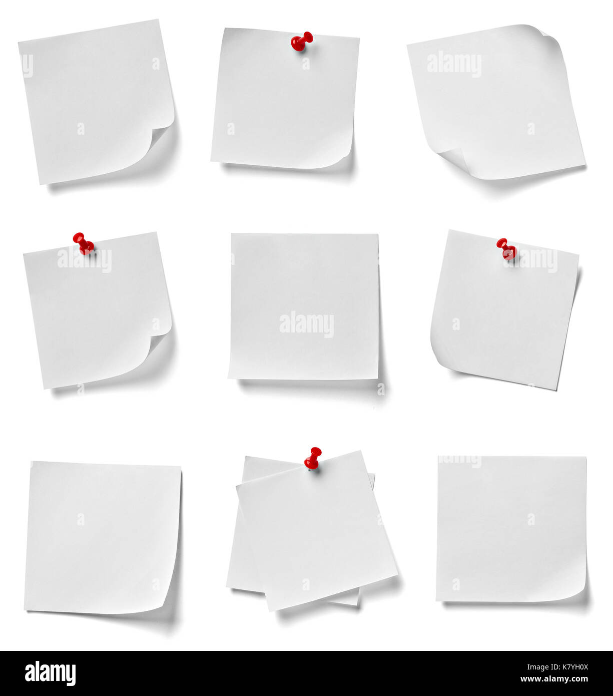 collection of various note paper with a red push pin on white ...