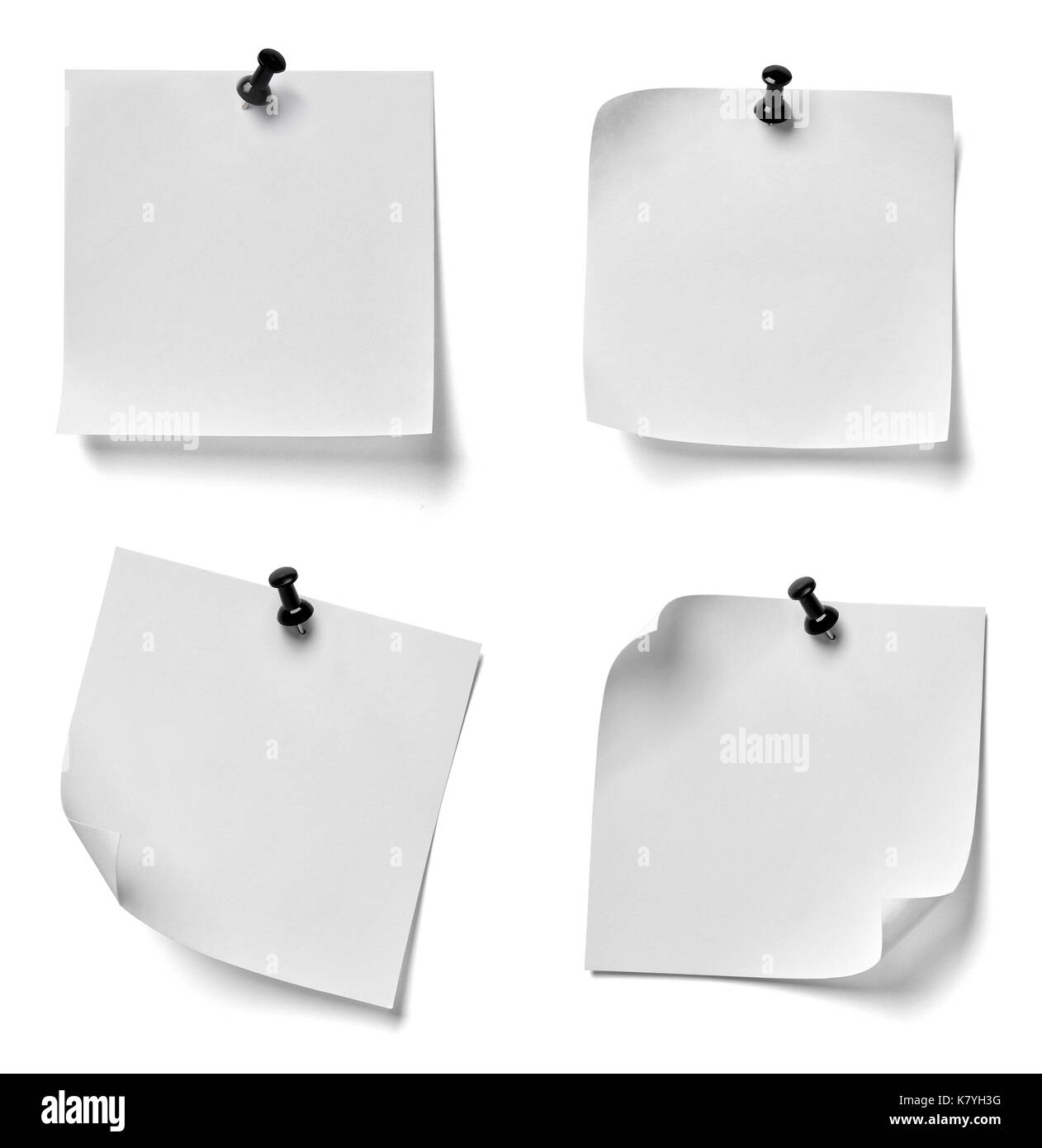 collection of various note paper with a red push pin on white ...