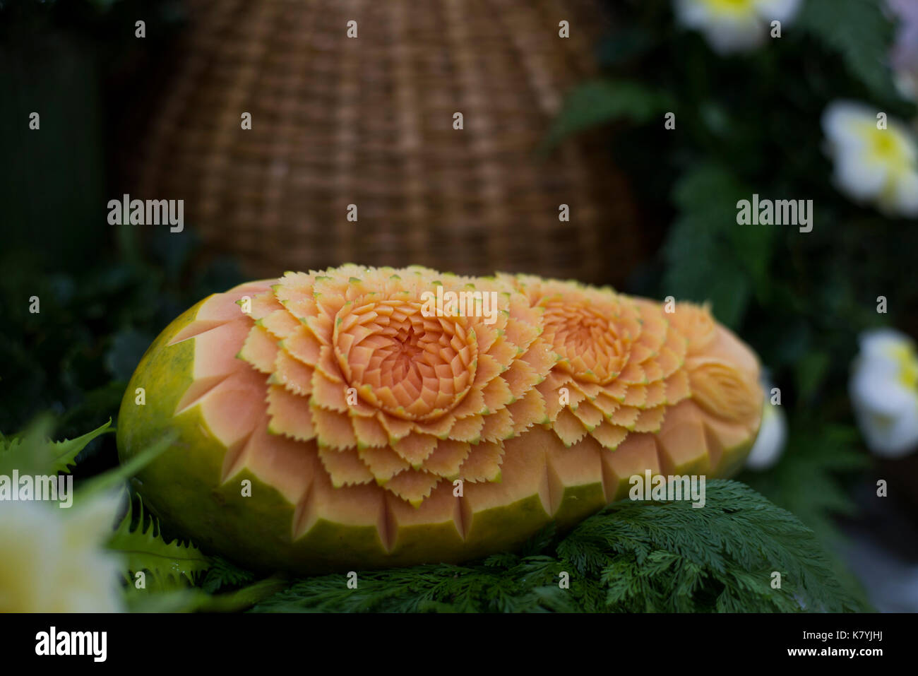 Thai fruit carving is a traditional Thai art that requires neatness, precision, meditation, and personal ability. Fruit carving persisted in Thailand  Stock Photo