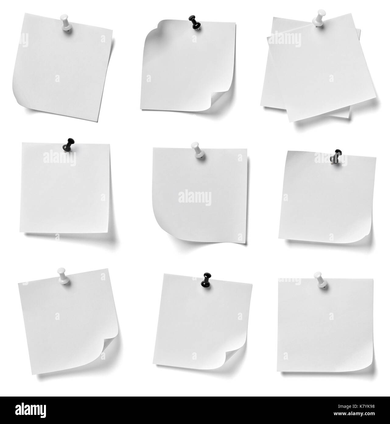 collection of various note paper with a red push pin on white ...