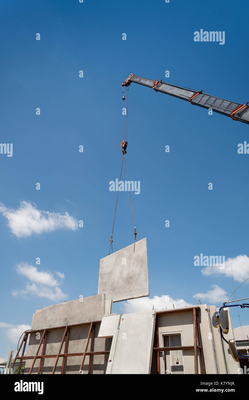 Construction crane lifting precast concrete hires stock photography