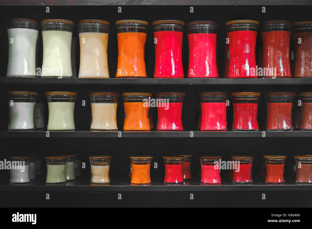 candle store scented candles shelves black background shelf matte Stock Photo