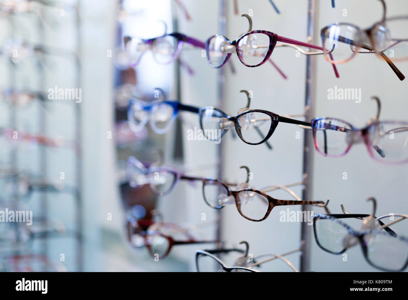 Many different glasses displayed at optician in store Stock Photo - Alamy