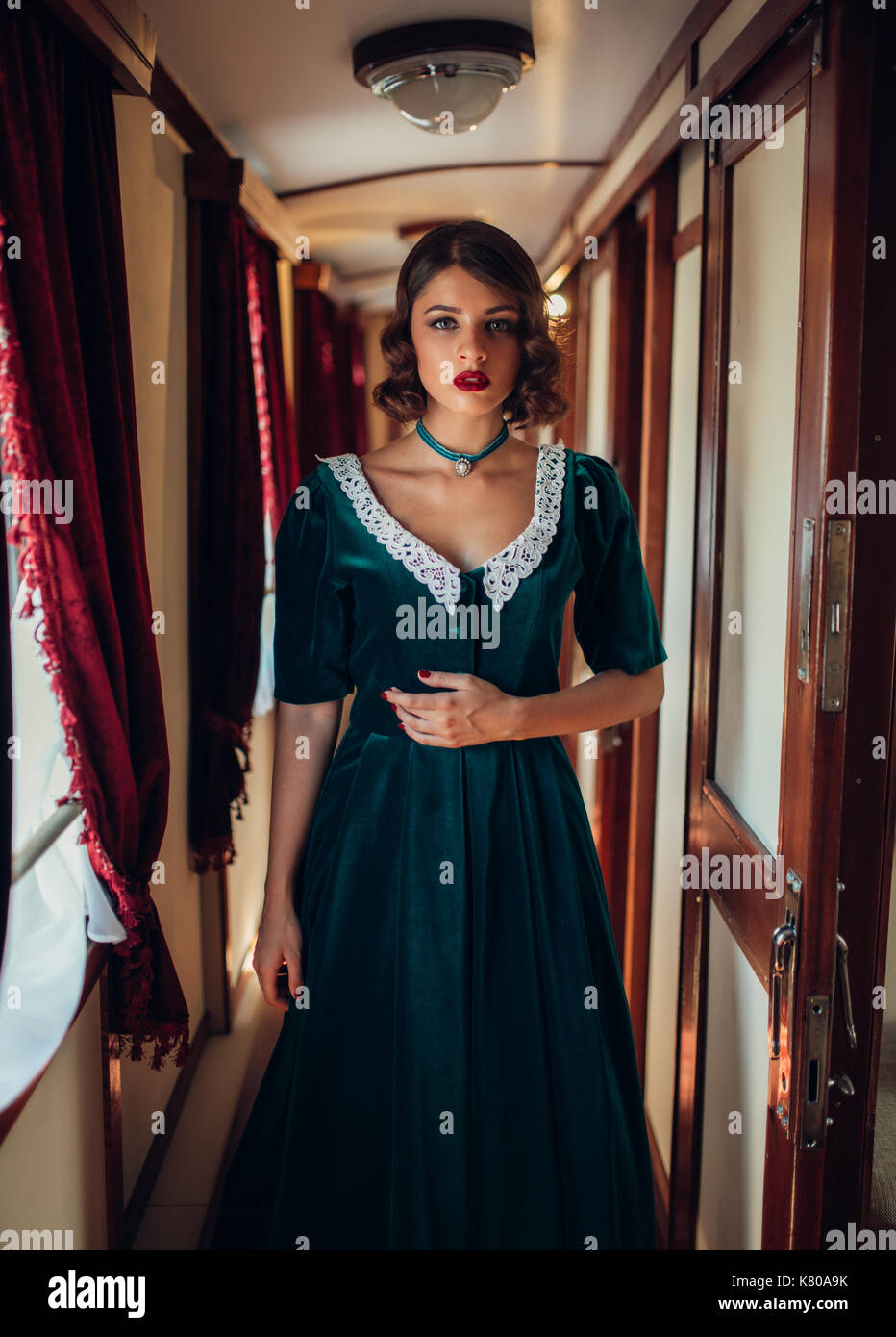 Railway journey, woman in retro dress, vintage train compartment interior.  Old wagon. Railroad voyage Stock Photo - Alamy