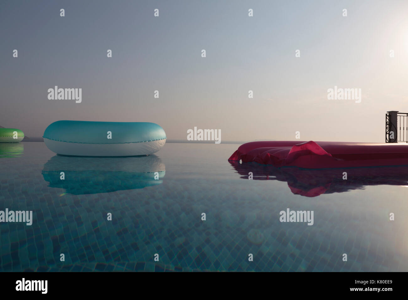 Lie Low and floating rings in swimming pool Stock Photo