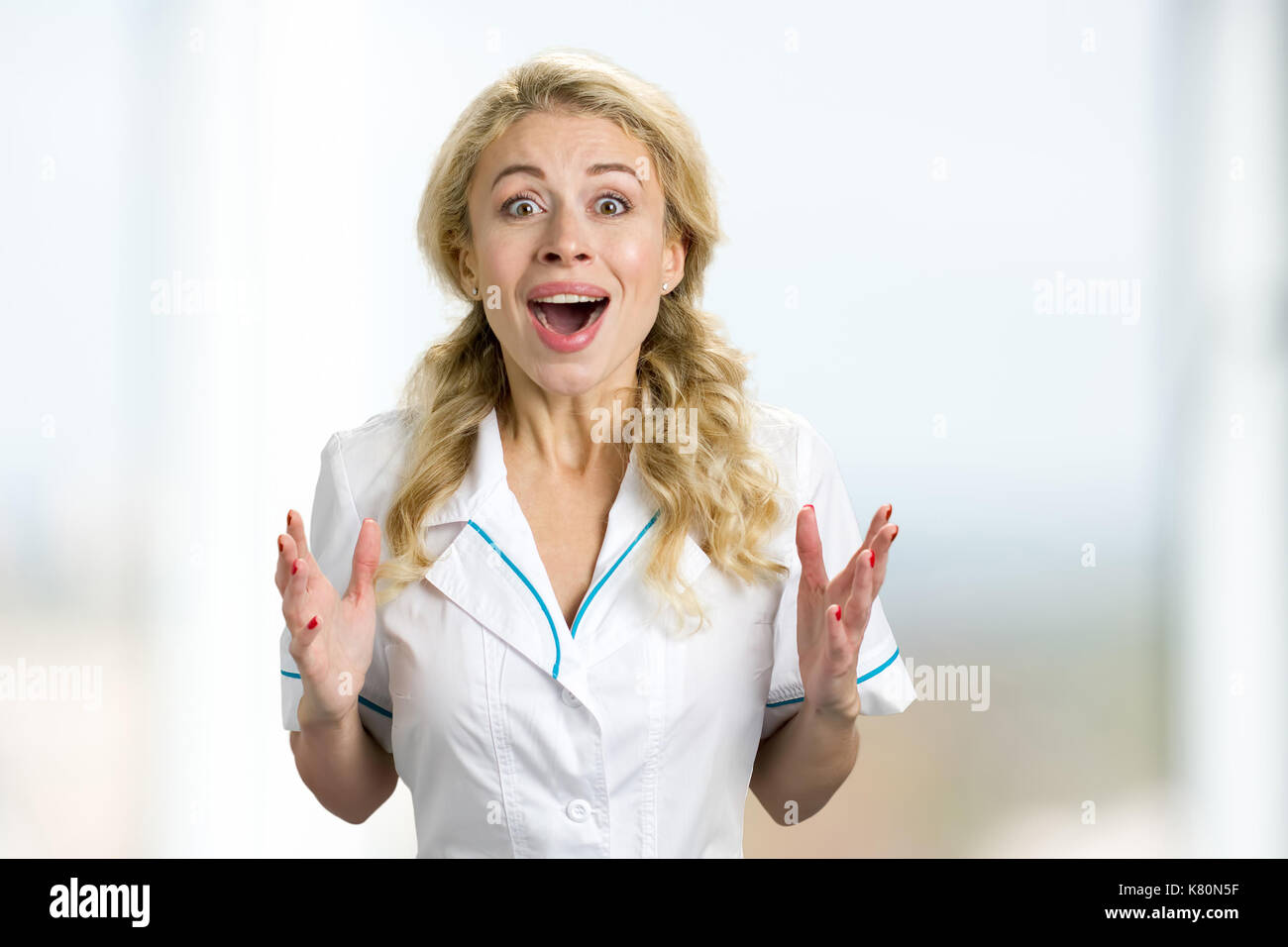 Excited beautiful young nurse Stock Photo - Alamy