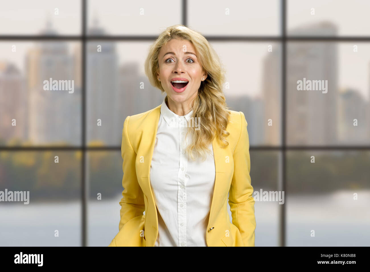 Surprised young happy business woman Stock Photo - Alamy