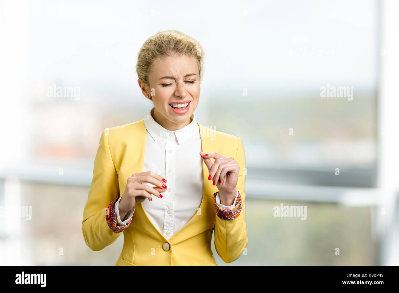 Portrait of young emotional woman singing. Stock Photo