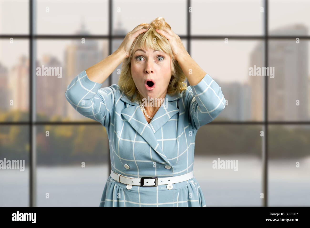 Mature blonde woman surprised expression hi-res stock photography and ...