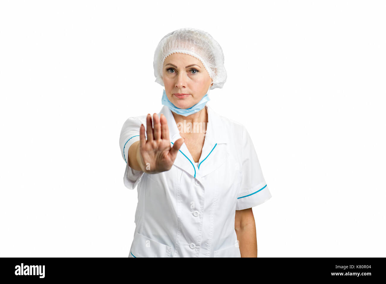 Adult female surgeon gesturing stop. Stock Photo