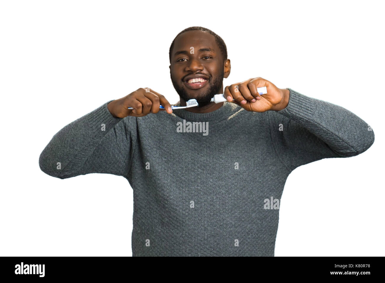 Black man with toothpaste and brush Stock Photo Alamy