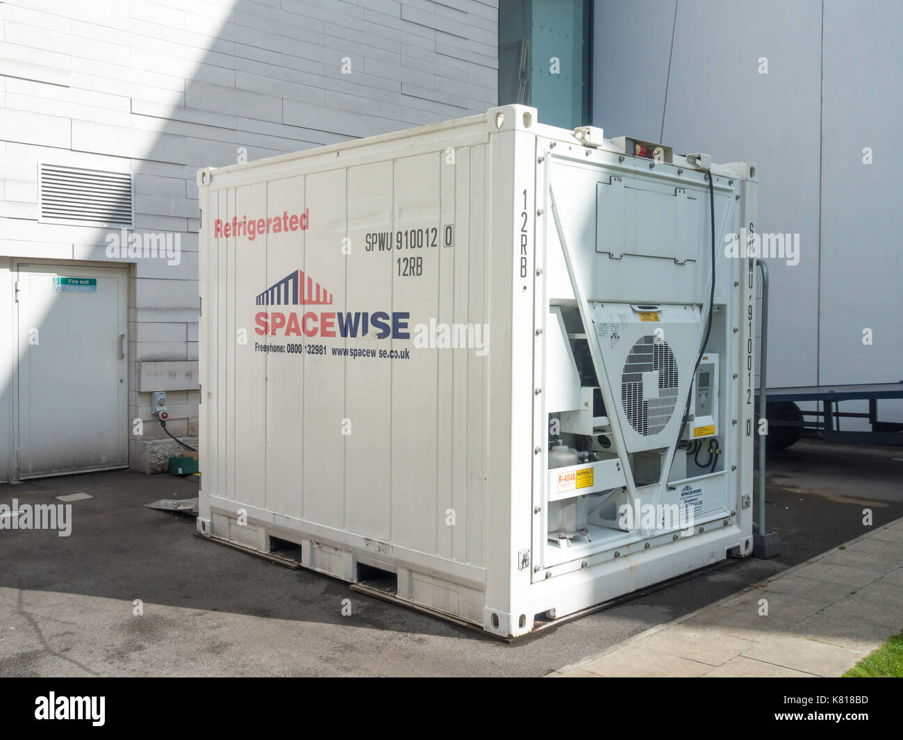 10 foot  size refrigerated transport container used for food storage behind a restaurant Stock Photo