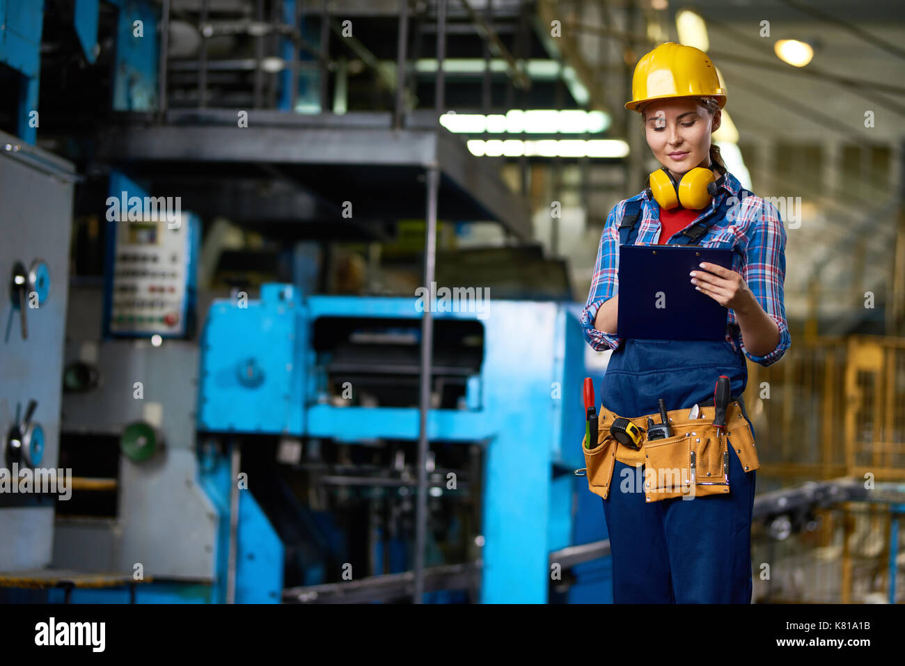 Attractive Plant Worker with Clipboard Stock Photo