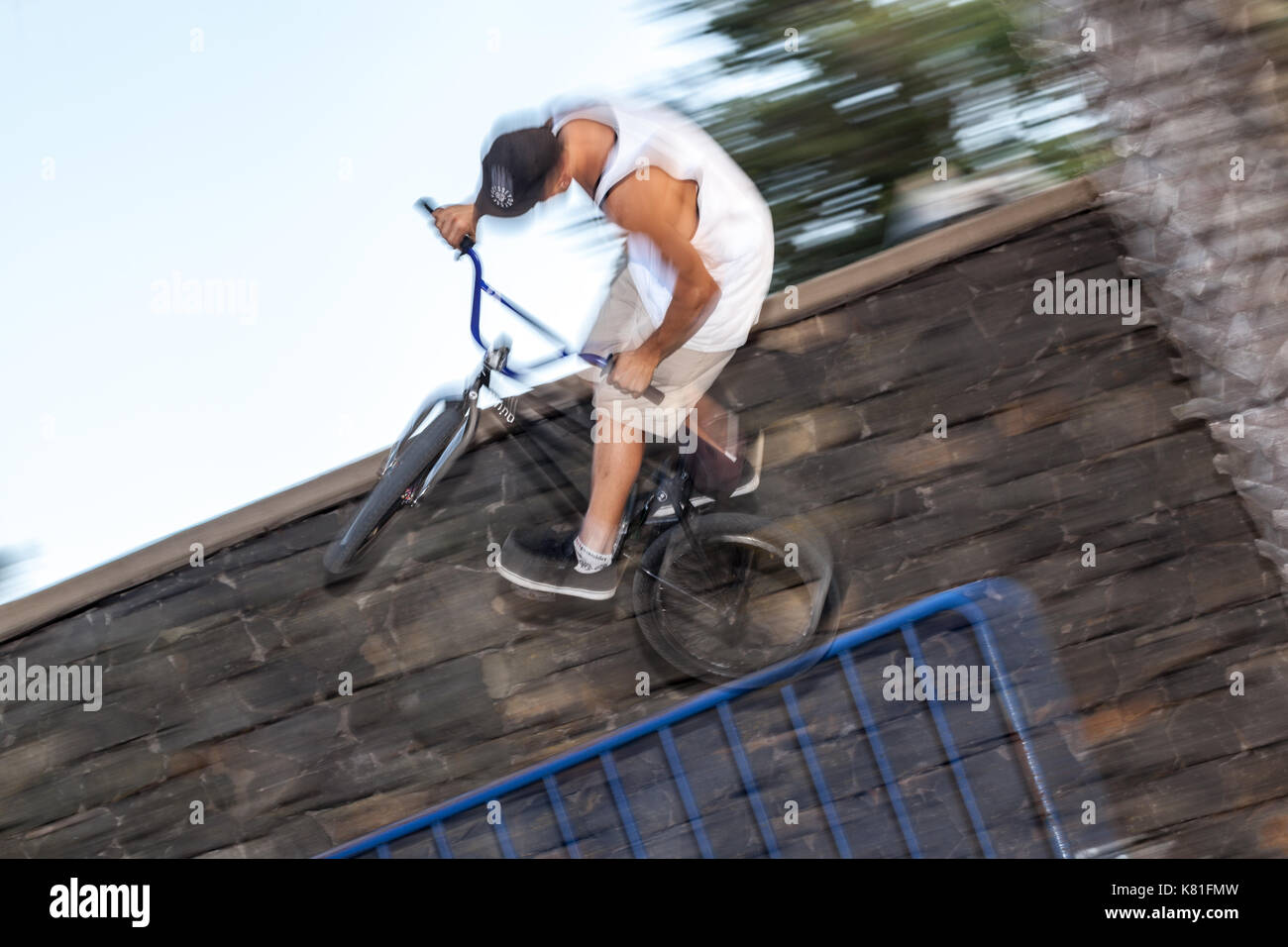 young adult riding on bmx at a skate 