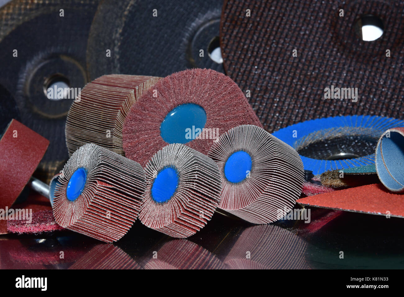 A pile of color abrasive sandpaper for metal working sandpaper for