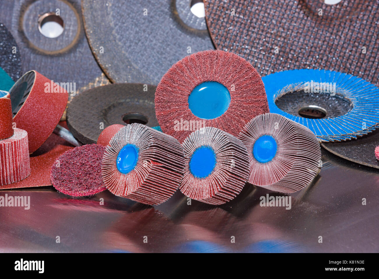 A pile of color abrasive sandpaper for metal working sandpaper for