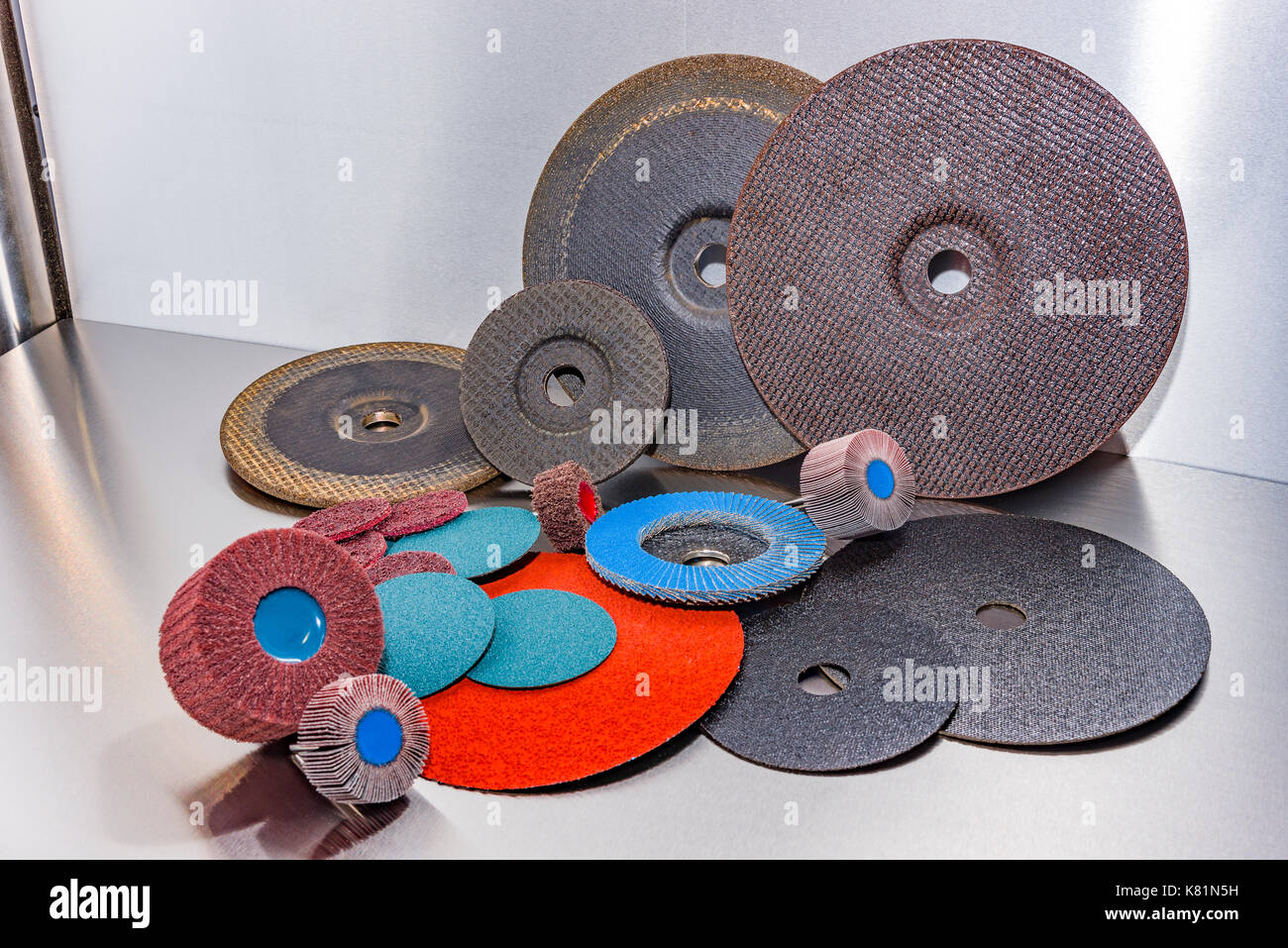 A pile of color abrasive sandpaper for metal working sandpaper for