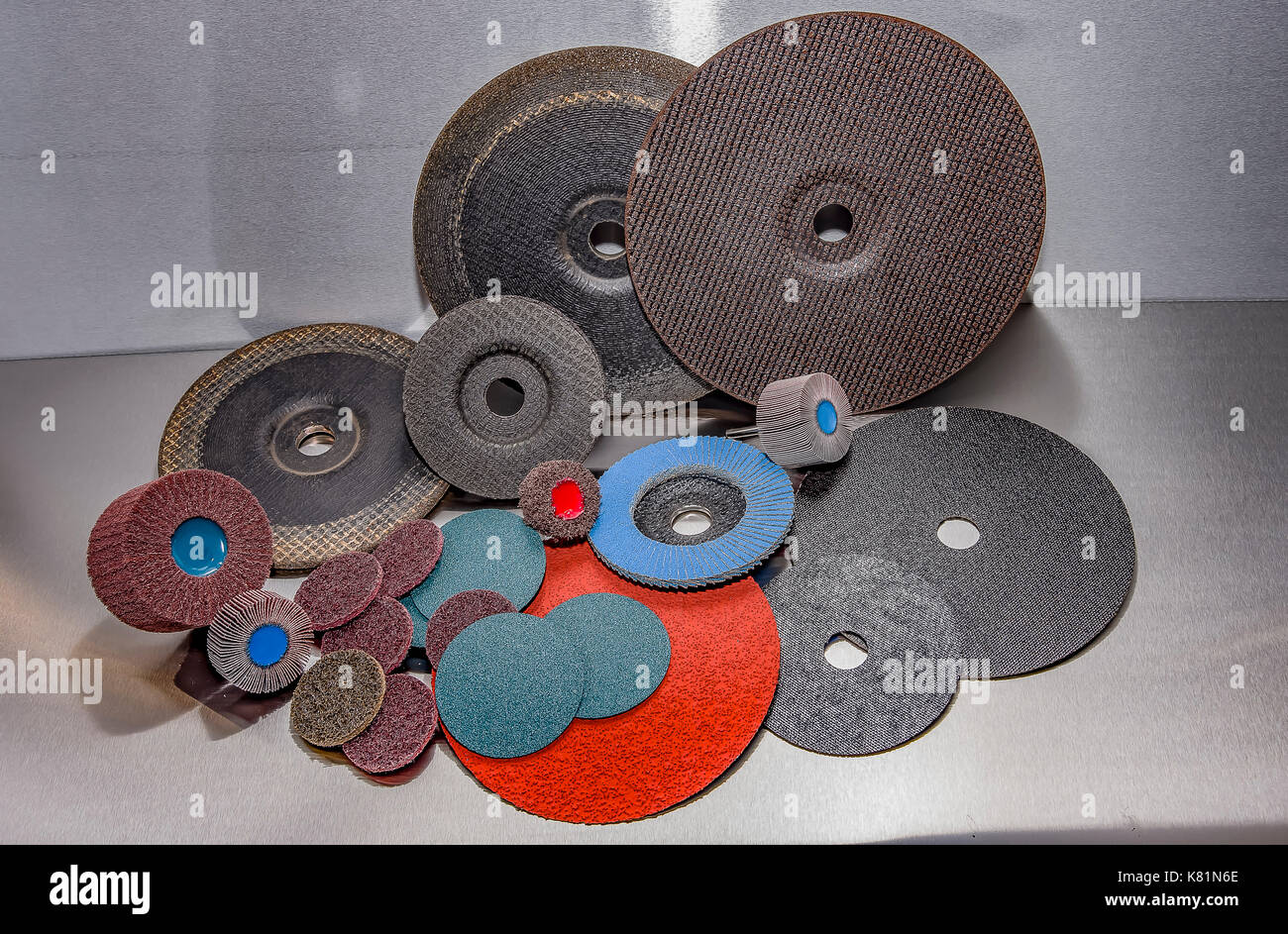 A pile of color abrasive sandpaper for metal working sandpaper for