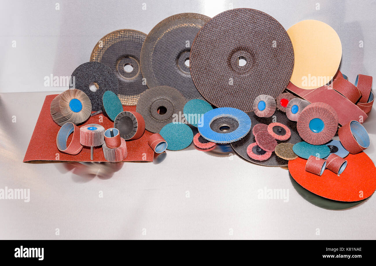 A pile of color abrasive sandpaper for metal working sandpaper for