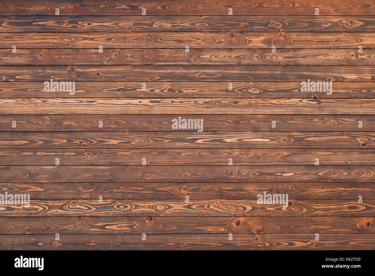 Background texture of dark brown horizontal wooden planks wall or floor