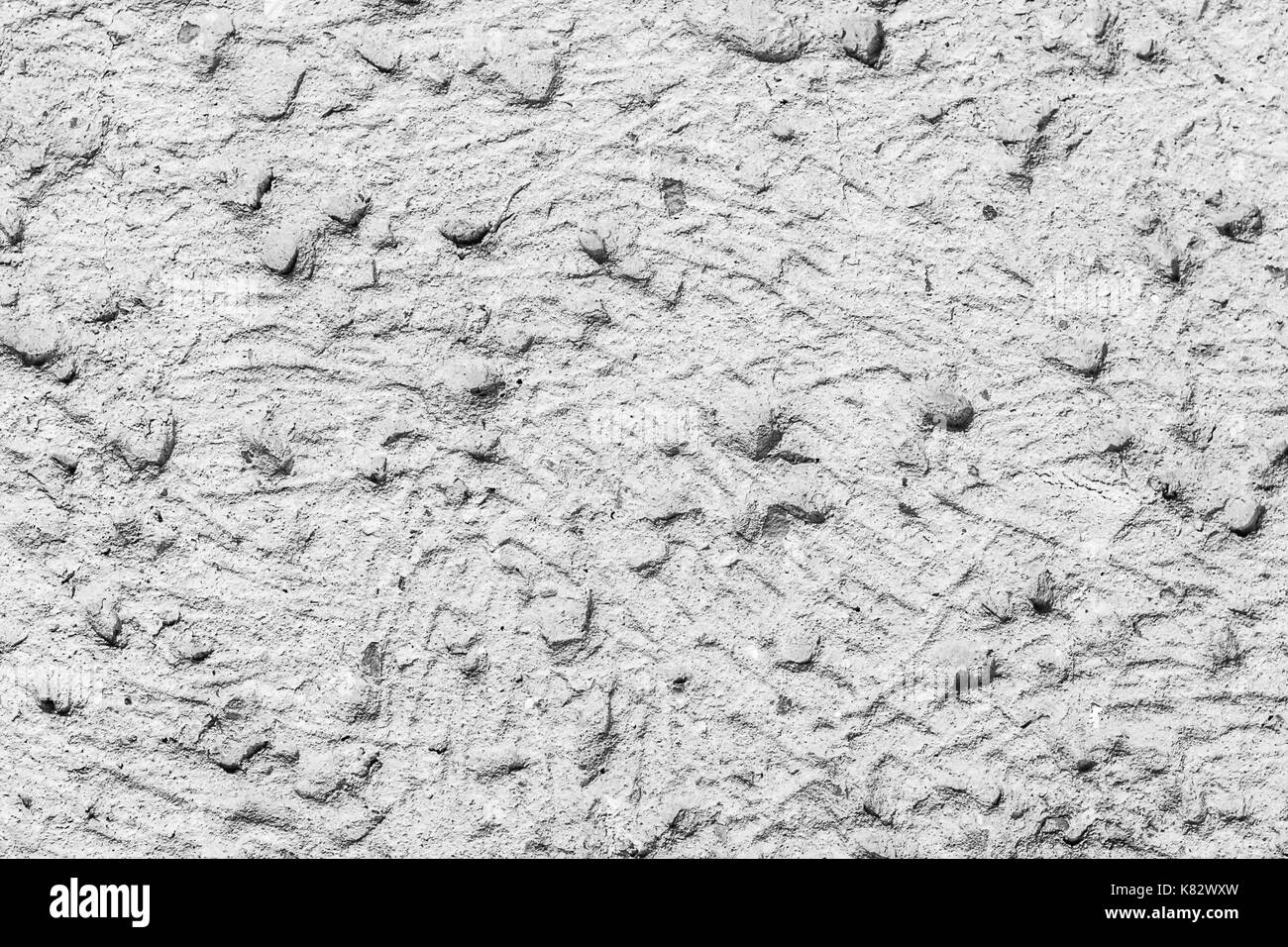 White concrete wall with natural texture and cracks on the surface as ...