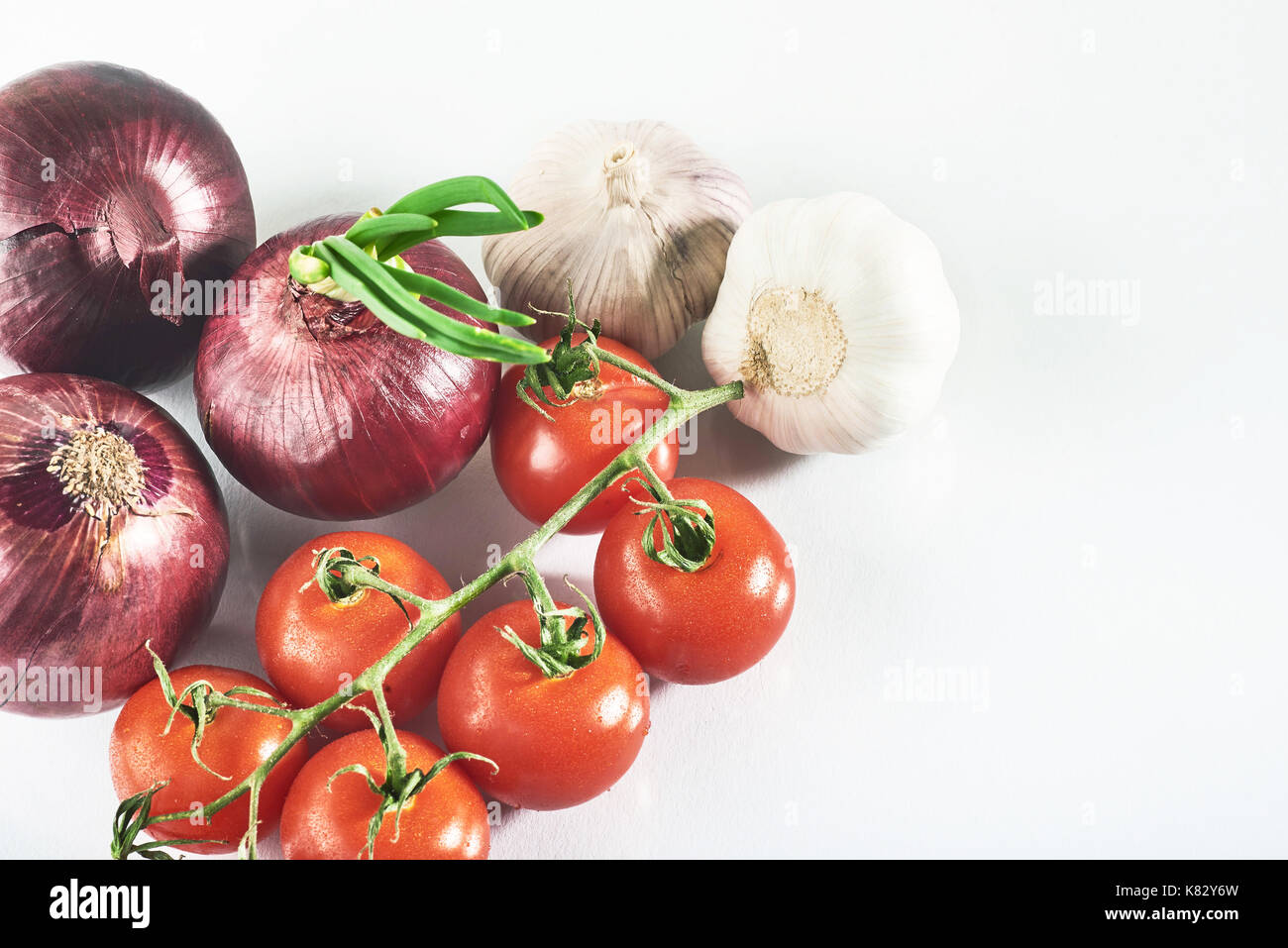 blue onion garlic and tomato isolated on white background Stock Photo ...