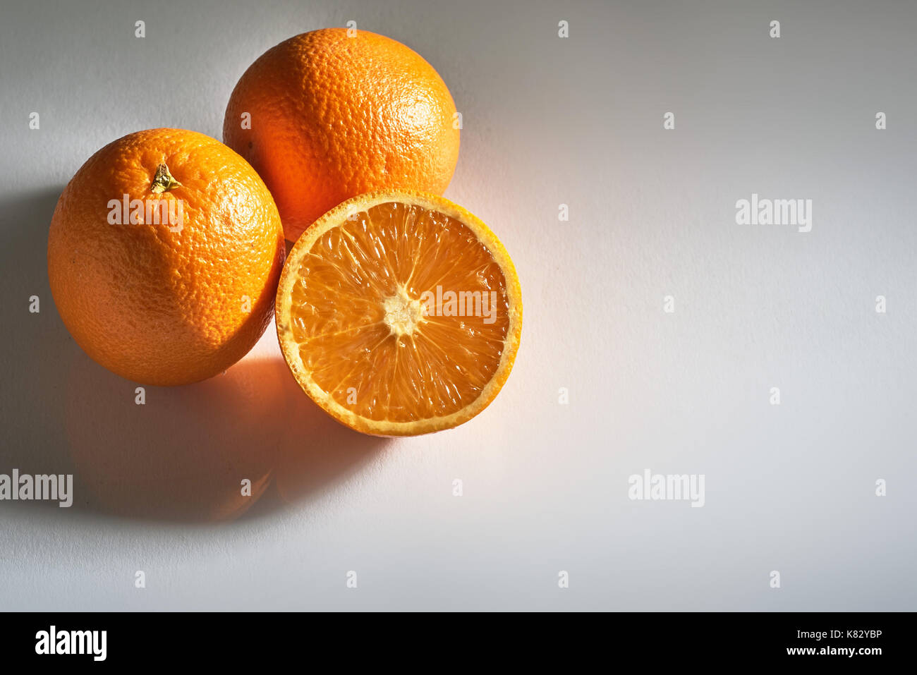 Delicious fresh oranges isolated on white background. Stock Photo