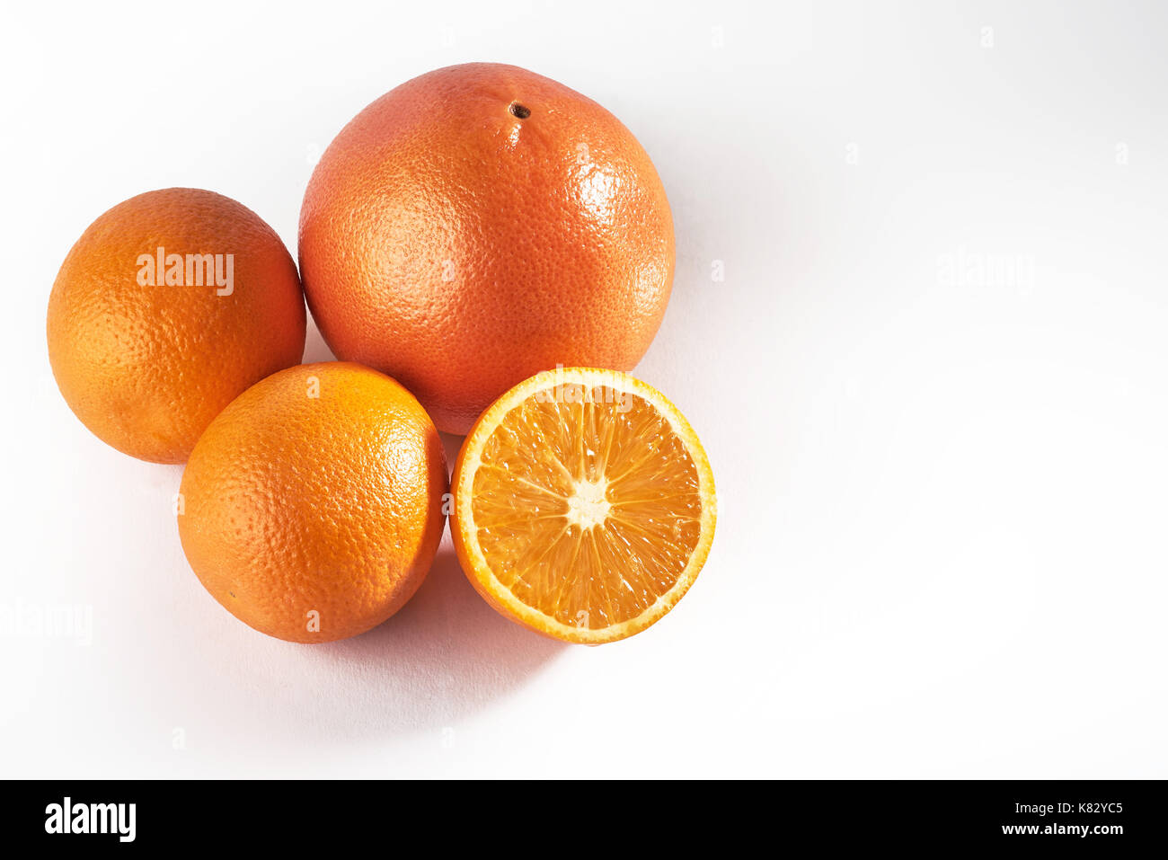 Delicious fresh oranges isolated on white background. Stock Photo