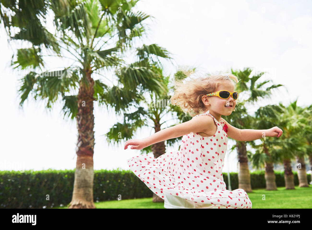 baby girl in a park near trees Stock Photo Alamy