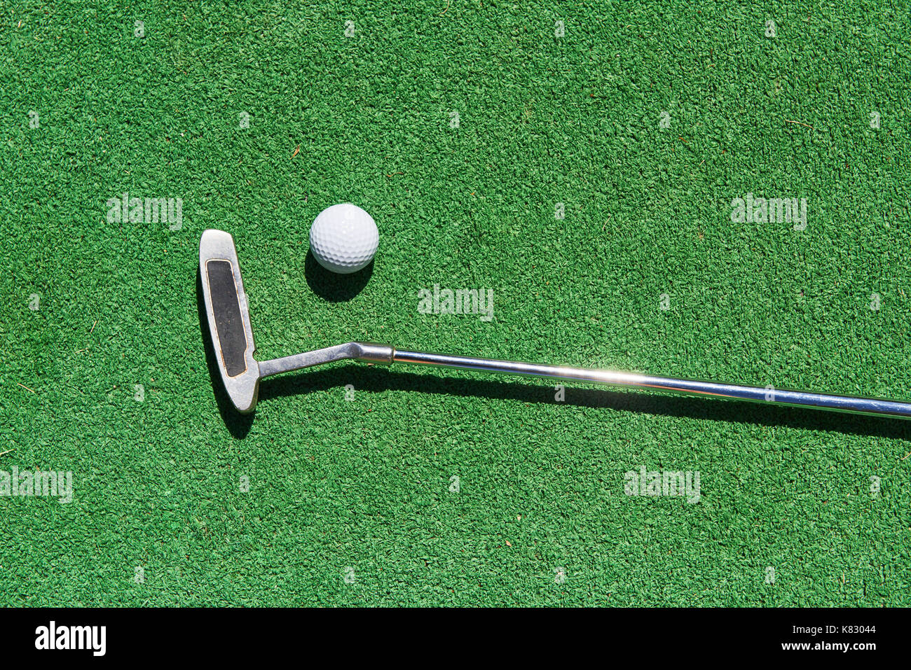 Mini-golf ball on artificial grass. Summertime Stock Photo - Alamy