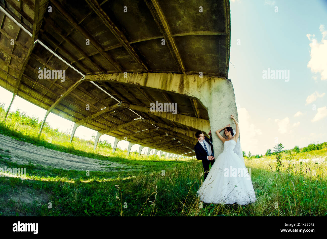 Ukraine, Lutsk - 09.08.2014: the Wedding ceremony. Lovers of nature walks in Park. Beautiful delicate and romantic couples, loving each other. Editori Stock Photo