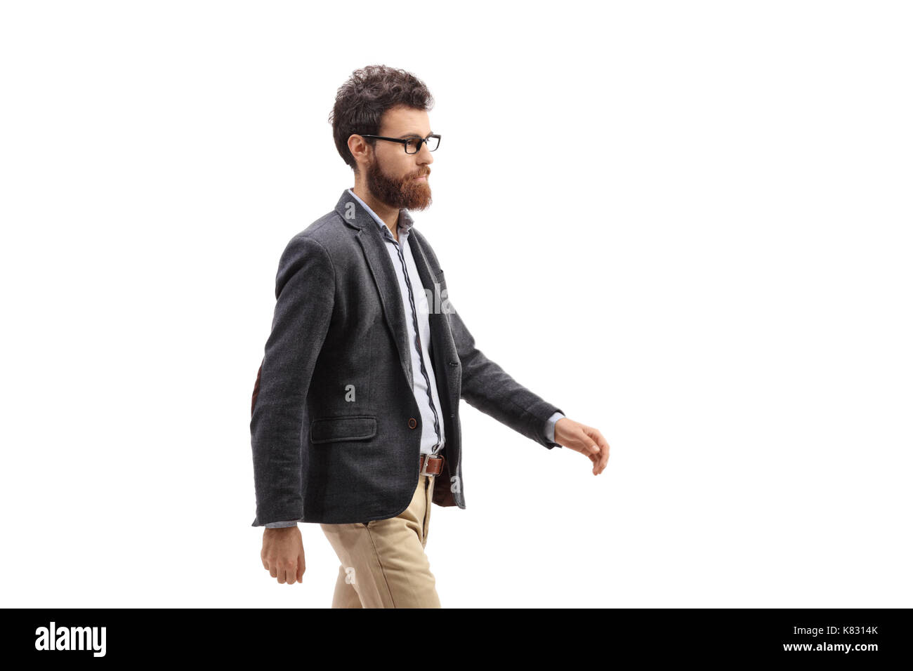 Young bearded man walking isolated on white background Stock Photo