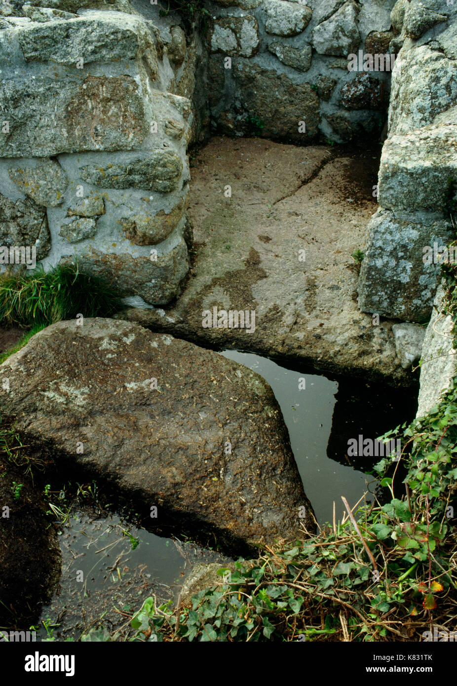 St Levan's holy well & baptistery above Porth Chapel Cove, West Penwith, Cornwall: healing well connected with C6th Celtic missionary St Selevan. Stock Photo