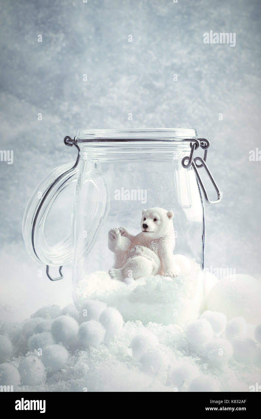 Polar bear in glass kilner jar snow scene for Christmas Stock Photo