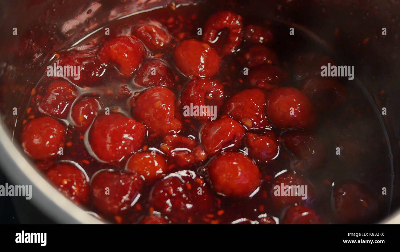 Cherry in syrup, boiled cherry. Boiling raspberry syrup. Preparation of ...