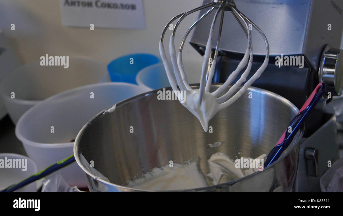 Cream in a blender for cake. Pastry blender after work Stock Photo Alamy