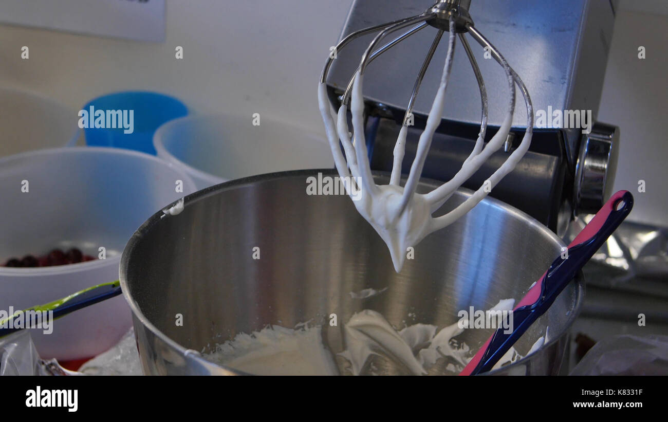 Cream in a blender for cake. Pastry blender after work Stock Photo Alamy