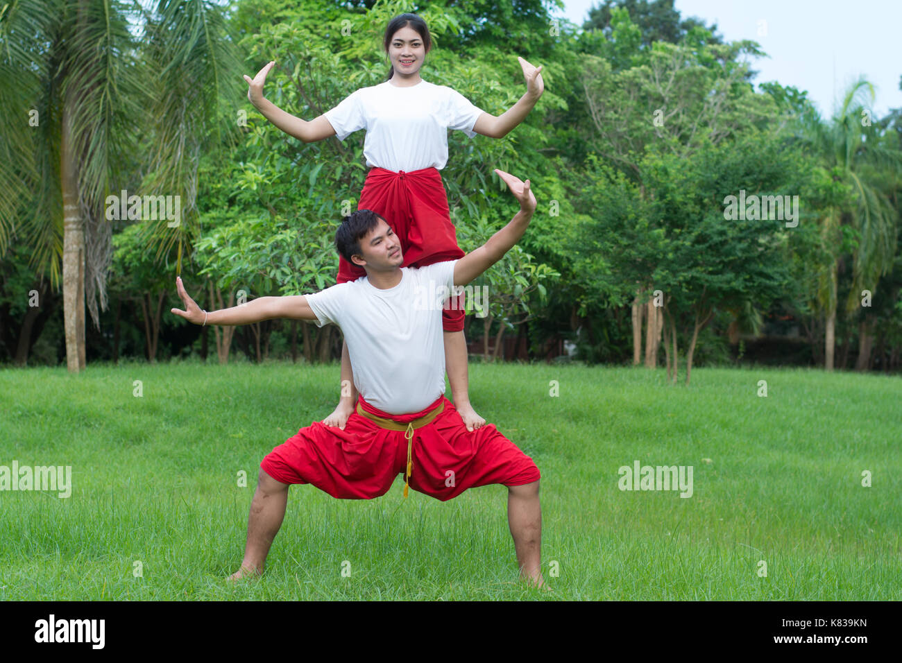 Asian young boy and girls learning Thai dance. Classical Dance in white
