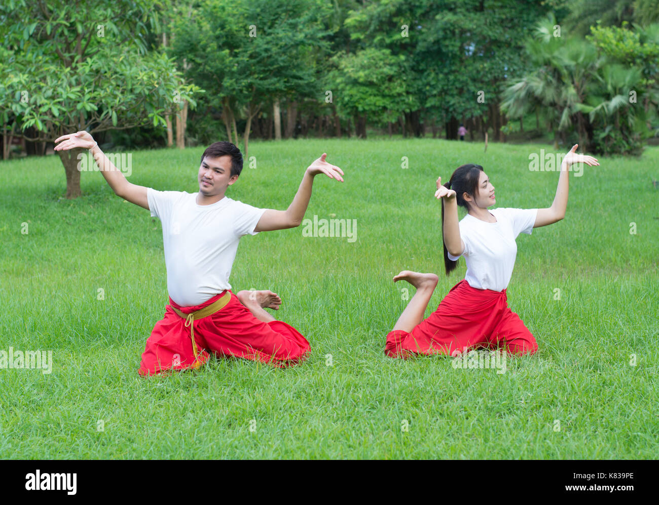 Asian young boy and girls learning Thai dance. Classical Dance in white