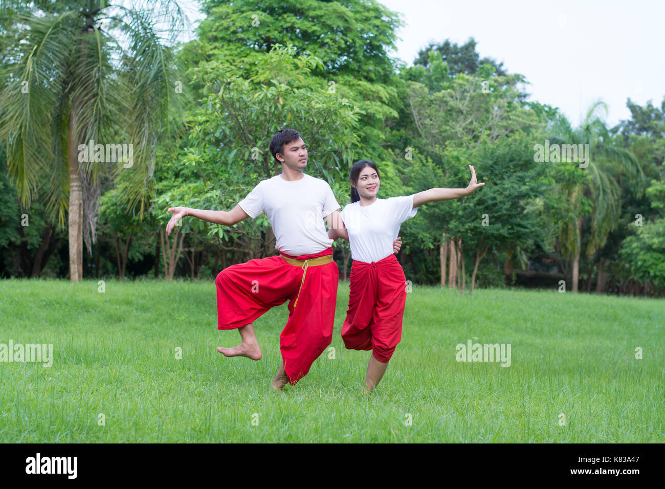 Asian young boy and girls learning Thai dance. Classical Dance in white