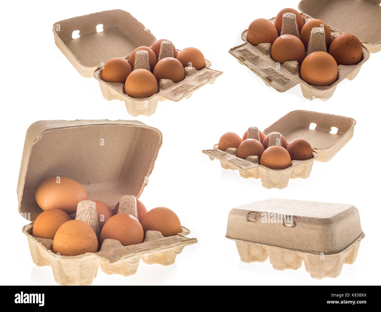 Cardboard egg box with six brown eggs isolated Stock Photo Alamy
