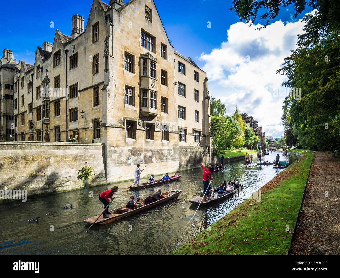 Tourists Punting on the River Cam in central Cambridge next to Kings College. Stock Photo