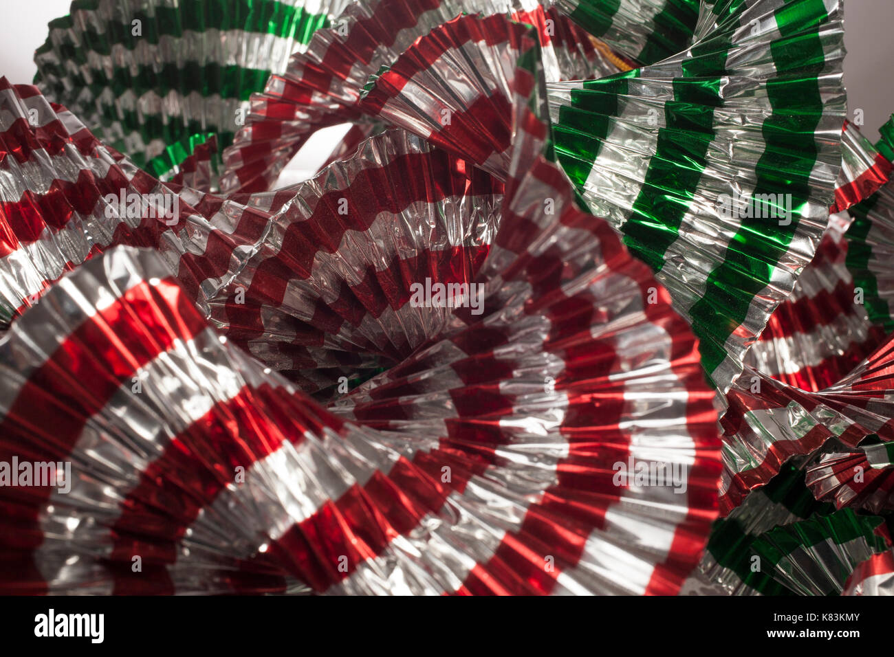 A Pile Of Crinkled Metal Streamers For Christmas Decorations Stock