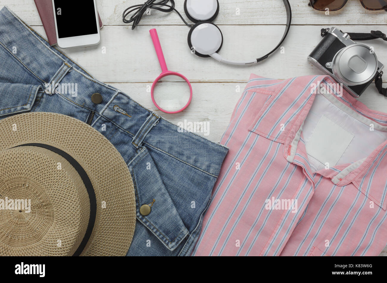 Top view of accessories clothing women to travel with technology background concept.Essential items for traveler or teenage and adult prepare to holid Stock Photo