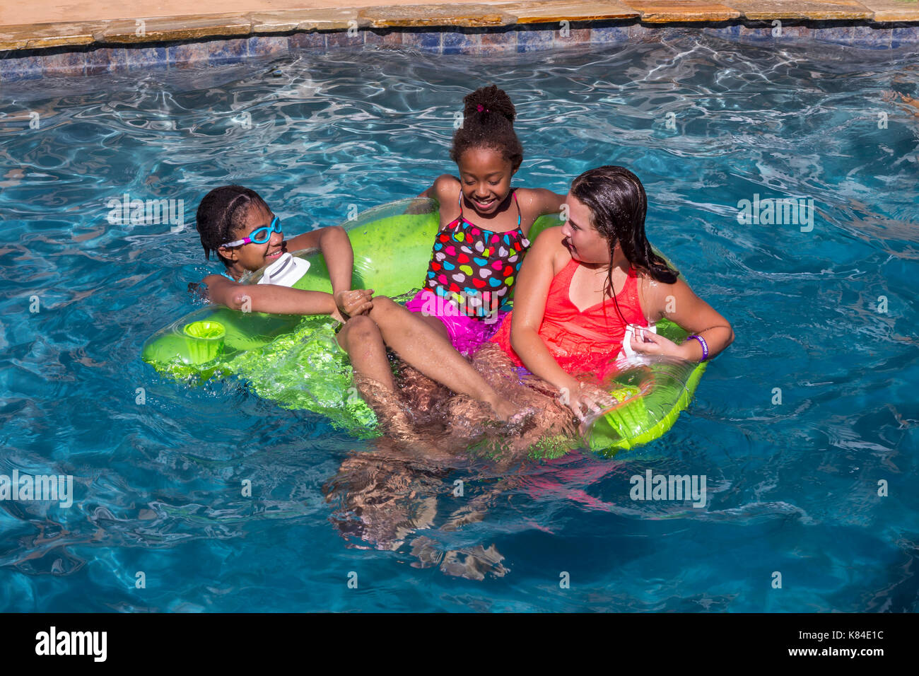 girls, children, swimmers, swimming, swimming pool, freshwater swimming pool, pool party, Castro Valley, Alameda County, California, United States Stock Photo