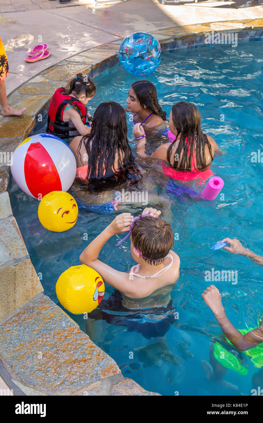girls and boys, children, swimmers, swimming, swimming pool, freshwater swimming pool, pool party, Castro Valley, Alameda County, California, United Stock Photo