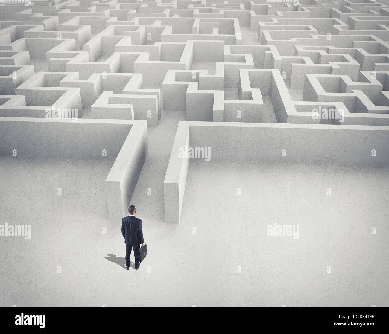 Business challenge. A businessman navigating through a maze. Top view Stock Photo