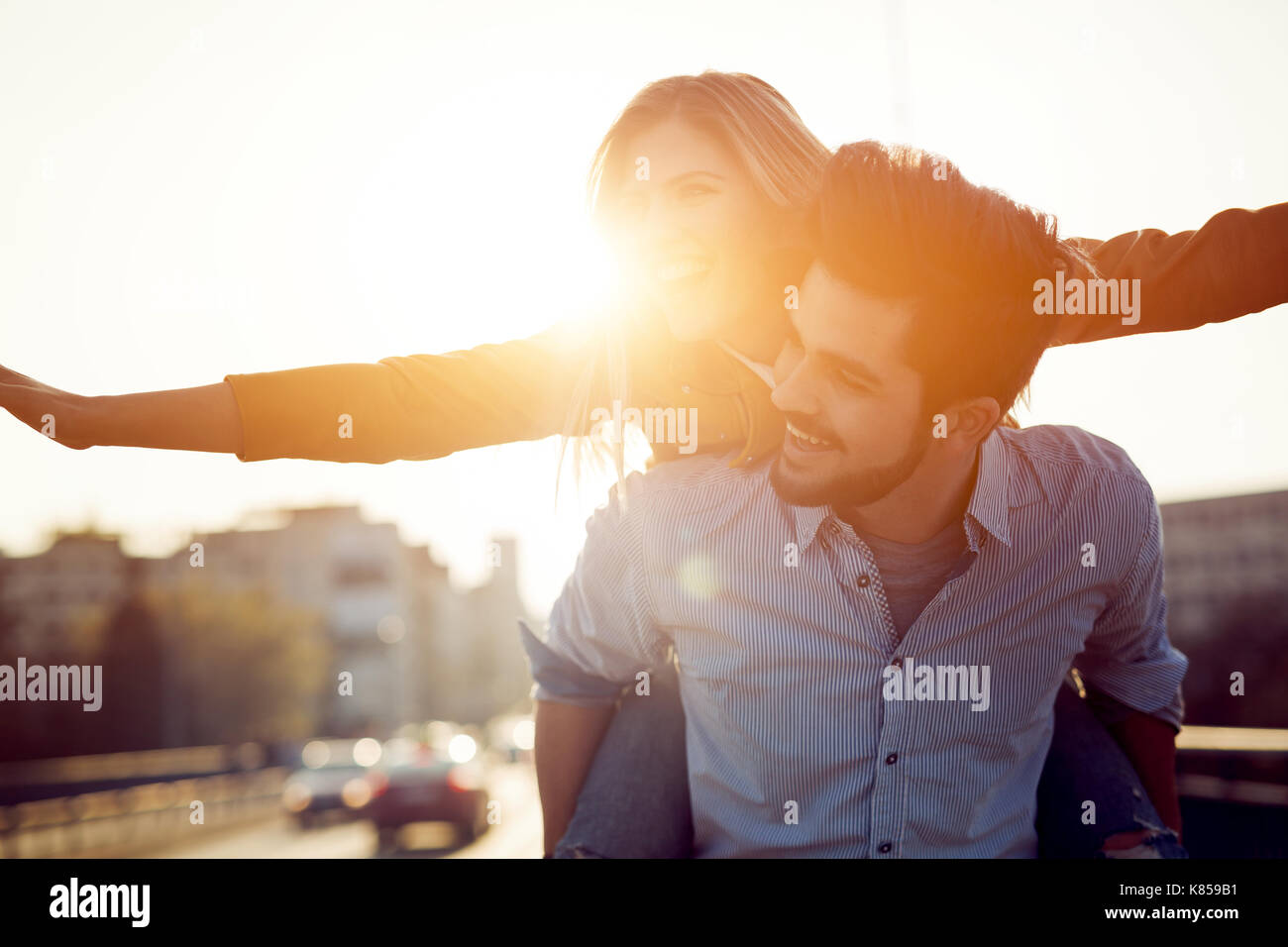 Portrait of loving couple dating at sunset in city Stock Photo